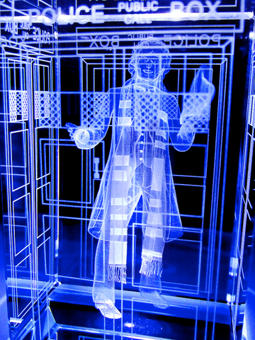 Tom Baker of Doctor Who laser-engraved in a crystal TARDIS replica on an LED-lit base